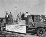 Boom Days Celebration; parade float with men standing next to model of oil derrick; sign reads in part: Discovery Well, Breckenridge Pool, The Texas Co., J.W. Parks No. 1, completed October 1916 by Basil Clemons 1887-1964