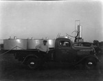 Oil tanks in background; sign on truck reads "Werner Tank Co., Breckenridge, Texas" by Basil Clemons 1887-1964