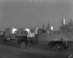 Oil tanks in background; sign on truck reads "Werner Tank Co., Breckenridge, Texas" by Basil Clemons 1887-1964