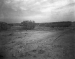 Empty field with stands of trees nearby; oil fields near Breckenridge, Texas by Basil Clemons 1887-1964