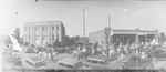 Parade with people on horseback and in automobiles through downtown Breckenridge, Texas; photo titled "1941 Fair" by Basil Clemons 1887-1964