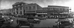 Parade with people on foot and automobiles through downtown Breckenridge, Texas by Basil Clemons 1887-1964