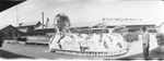 Panoramic photograph of an unidentified parade showing a float labeled "Fort Worth," Breckenridge, Texas by Basil Clemons 1887-1964