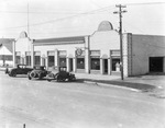 Three automobiles parked outside McMurtry Moody Motor Company, authorized Buick service, Breckenridge, Texas by Basil Clemons 1887-1964