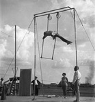 Circus performer on a high swing, Breckenridge, Texas by Basil Clemons 1887-1964