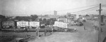 A.G. Barnes Circus cars being unloaded from a flatbed train, Breckenridge, Texas by Basil Clemons 1887-1964