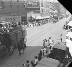 Circus parade in a downtown setting, location not identified by Basil Clemons 1887-1964