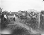 John Robinson's Circus; team of horses pull circus wagons over muddy ground, Breckenridge, Texas by Basil Clemons 1887-1964