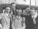 Five men post aside a car by Basil Clemons