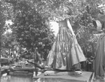 Young girl wearing a formal dress by Basil Clemons 1887-1964