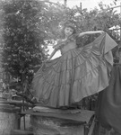 Young girl wearing a formal dress by Basil Clemons 1887-1964