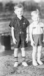 Two young boys, both wearing shorts by Basil Clemons 1887-1964