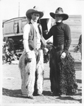 Two cowboys in fuzzy chaps by Basil Clemons 1887-1964