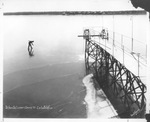 Ice skater on frozen lake near dock by Basil Clemons 1887-1964