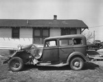 Side view of wrecked car, ca. 1950s by Bill Wood Photo Company