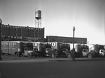 Howard Van Lines trucks in front of Morrison Supply Company by Bill Wood Photo Company