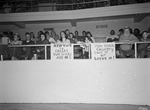 Wrestling at Will Rogers Coliseum; fans with signs "New York to Dallas, Von Erichs are #1" and "Von Erich Country, Love it or Leave it" by Cirrus Bonneau