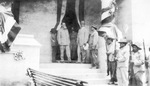 Carranza at his home surrounded by men with rifles wearing sombreros