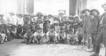 Federal prisoners, many wearing sombreros