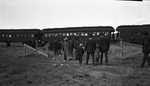 Passenger train on tracks in a field, Wyoming by Charles M. Davis