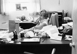 Chris Miller at her desk