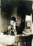 James M. Terrill on a telephone at a desk, Grubbs Vocational College