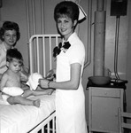 Nurses caring for a pediatric patient