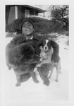 Young boy with dogs in the snow