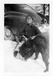 Young boy with dogs in the snow