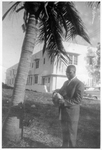 Dr. Harold Culmer holding a coconut