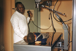 Dr. Harold Culmer examining a patient