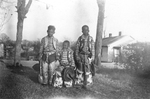 Young boys dressed in cowboy outfits