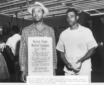 S. R. Tankersley and Elmer Joe Martin, strikers with sign at Elite Theatre