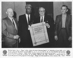 Guy L. "Pappy" Luther shakes hand of S. R. Tankersley