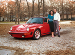 Arinne and David Keens in front of car