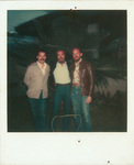 Jamie Bennett, David Keens, and Gary Griffin in front of palm tree