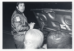 Unidentified Man with Trash Bag