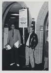 Two Men with Signs