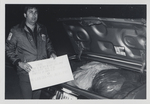 Man Holding Christmas Sign