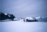 Boarding the Zodiac on sea ice next to Skua Island in Antarctica. by David Finfrock