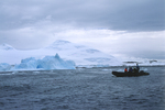 Iceberg collapsing near Two Hummock Island in Antarctica.