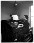 Mrs. Tauner playing an organ by John Messina Studios