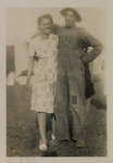 Man Standing Close to Woman