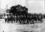 Group of cadets at Grubbs Vocational College on a field outside barracks