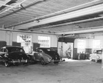 Three cars in the Vandergriff automobile body shop