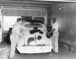 Two men in Vandergriff automobile body shop