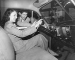 A woman and man in a 1949 or 1950 Chevrolet