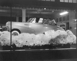 A Vandergriff window display of Santa sitting in new Chevrolet