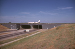 Airport runway crossing Highway 183