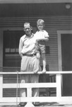 Jack D. White, about 4 years old, with his father John Nathan White on the porch of a house on Pearl Street, northside Fort Worth, Texas